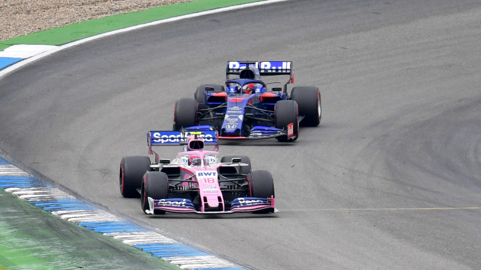 Lance Stroll, Racing Point RP19 and Daniil Kvyat, Toro Rosso STR14